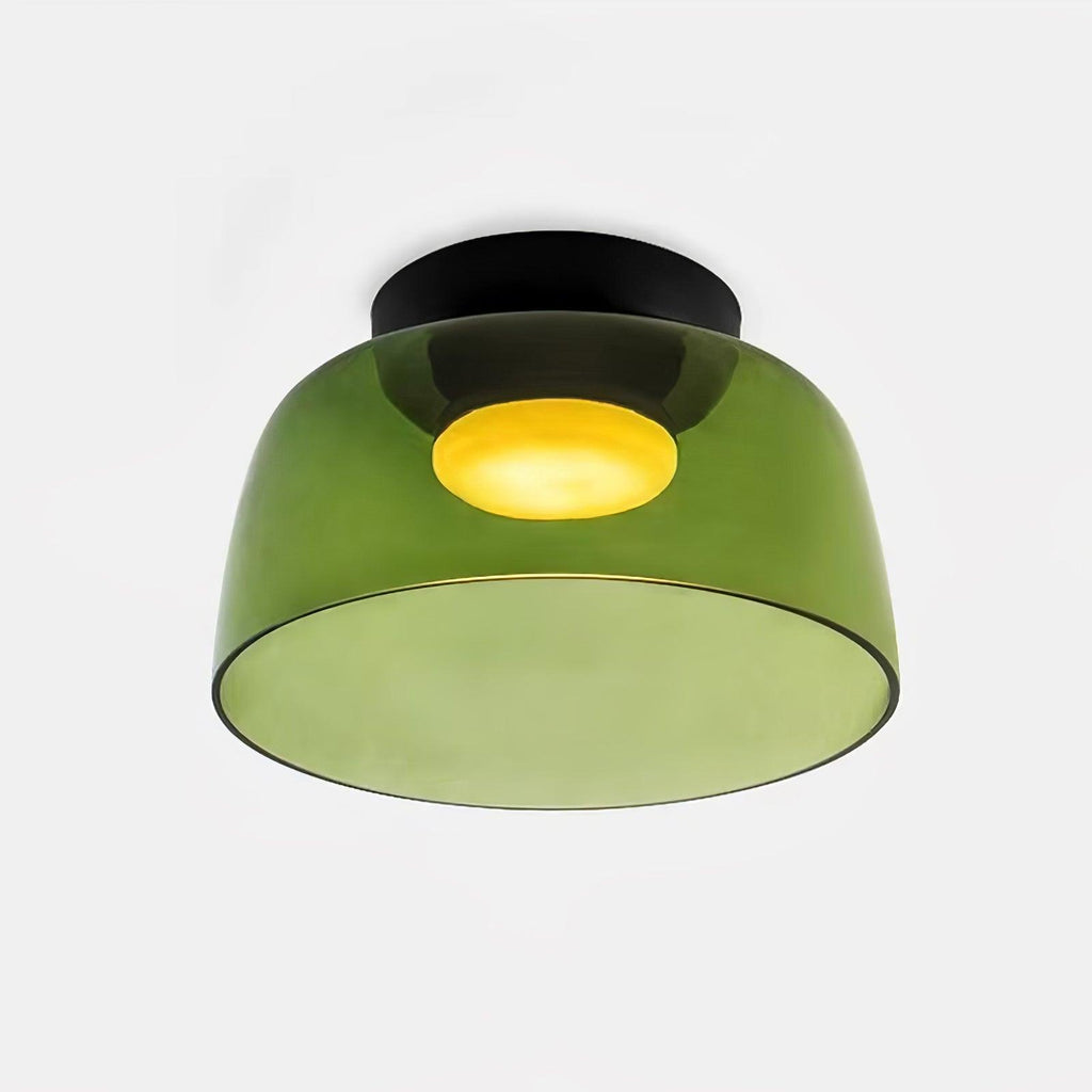 Flush mount glass ceiling light diffusing a balanced even glow