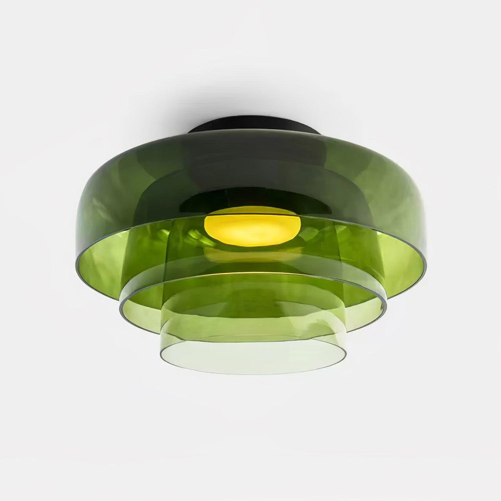 Layered glass-disc ceiling light glowing soft warm light indoors