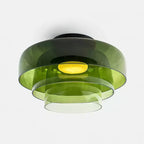 Orange tinted glass ceiling light diffusing a balanced glow