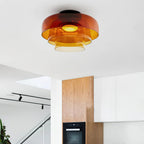 Stacked glass ceiling light casting soft even light from above