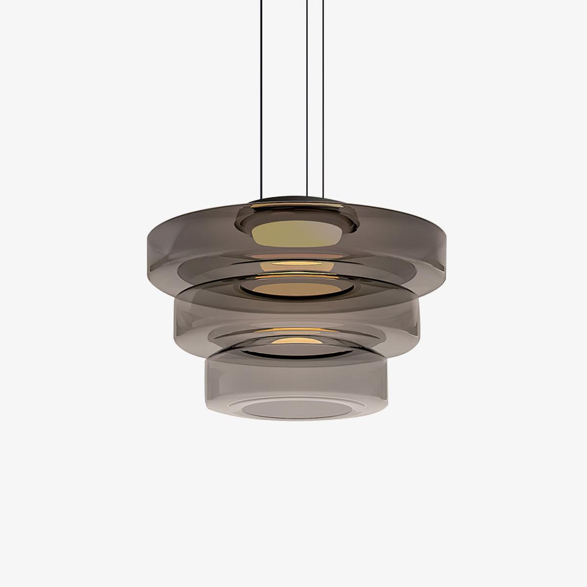 Mouth-blown glass disc pendant light catching warm light from within