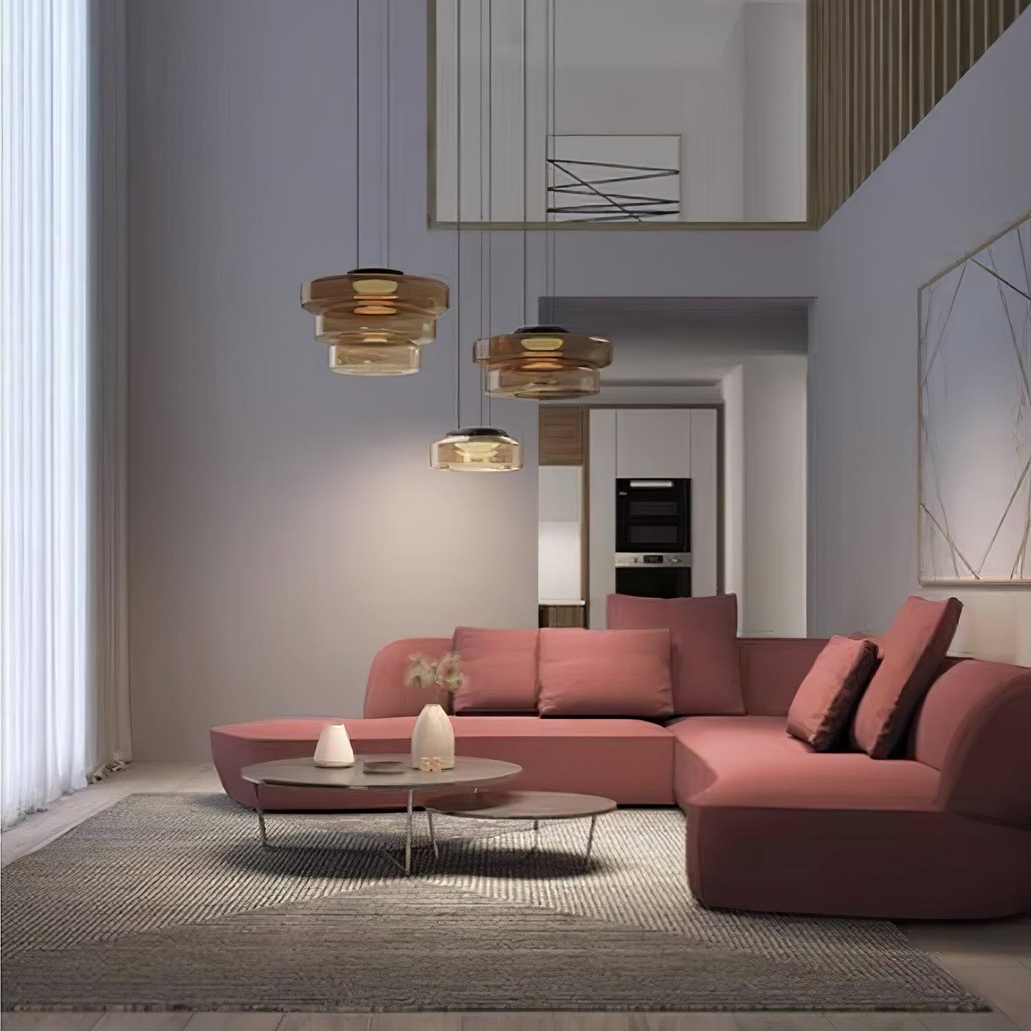 Layered glass pendant light suspended above a calm interior setting