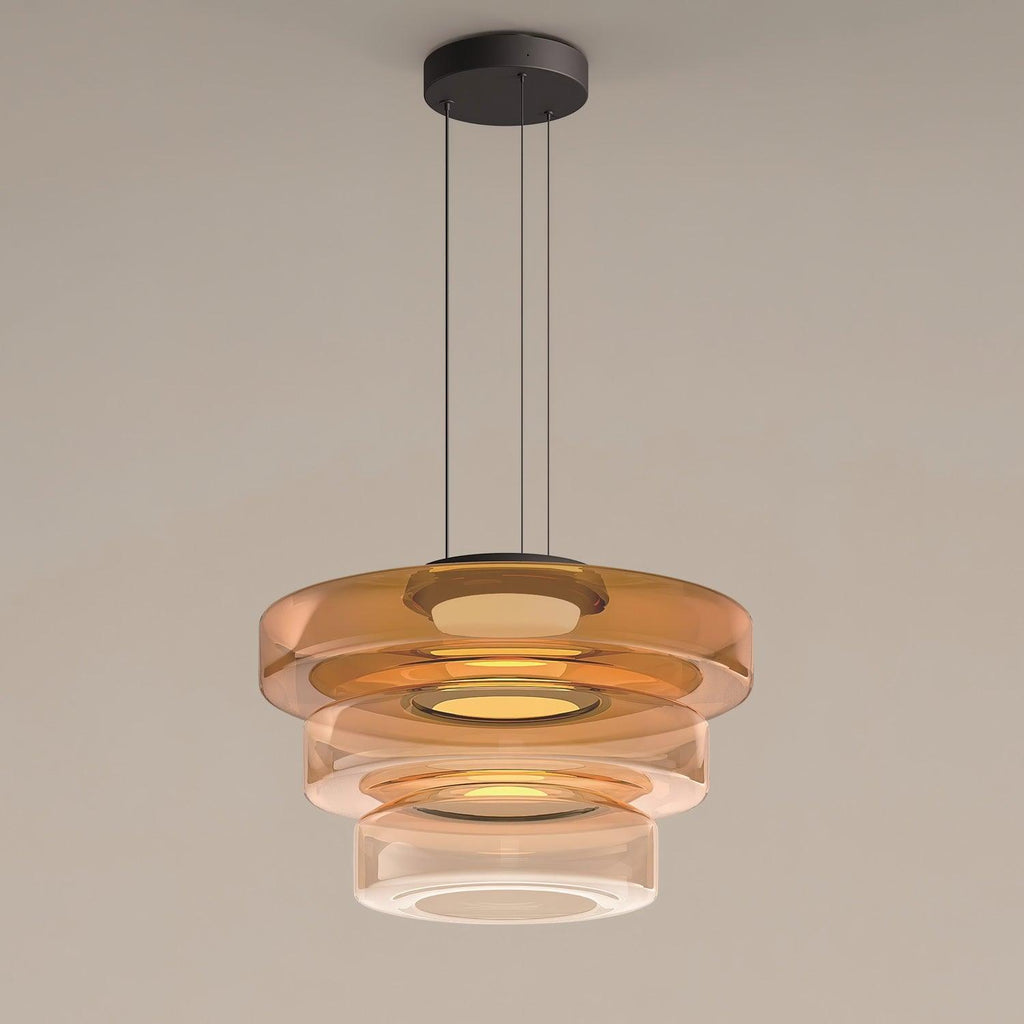 Green-tinted glass pendant light layered into a dimensional shade