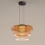 Green-tinted glass pendant light layered into a dimensional shade