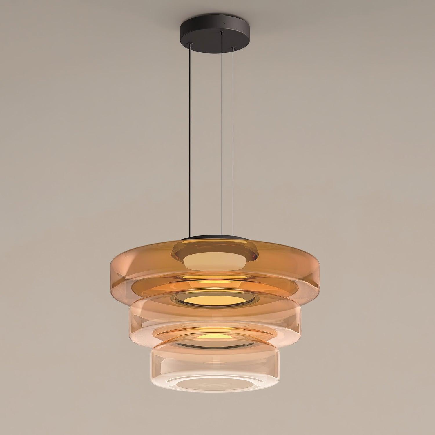 Green-tinted glass pendant light layered into a dimensional shade