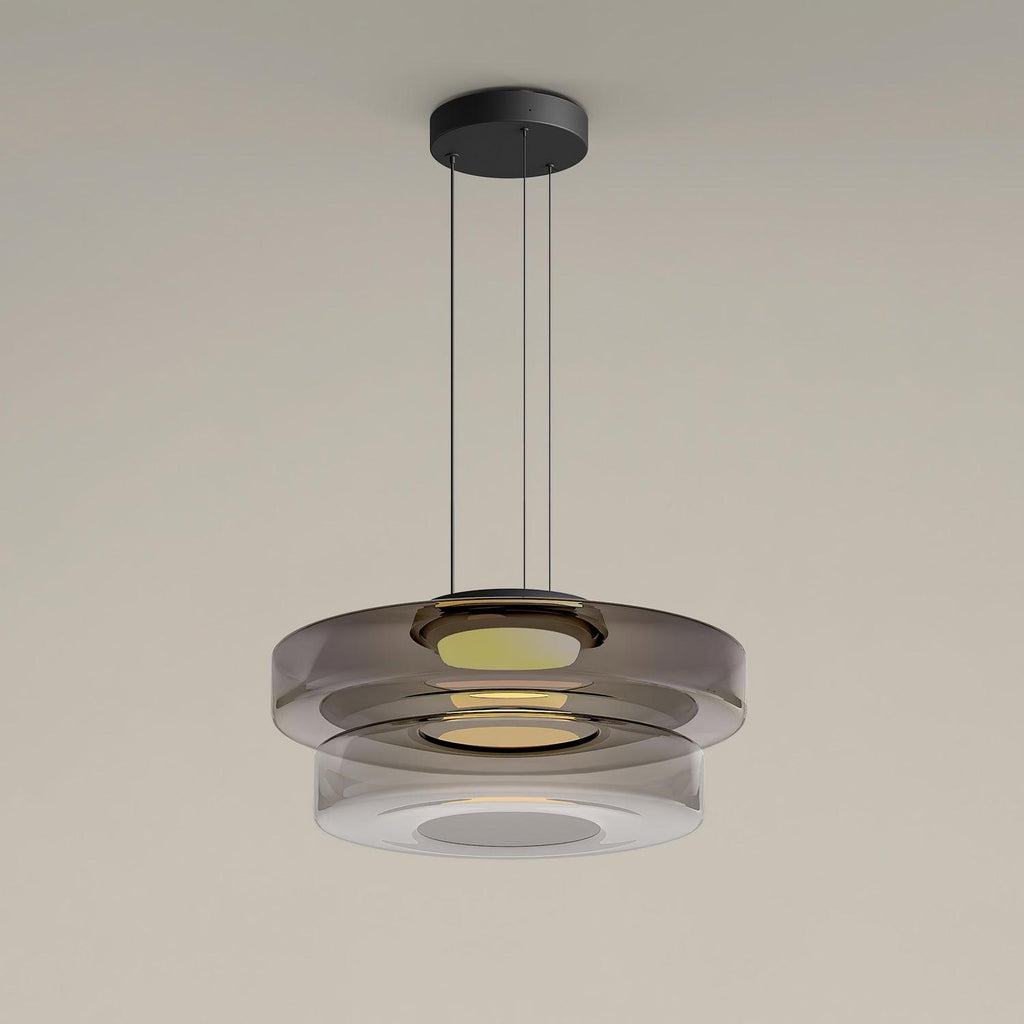 Single-layer glass pendant light hanging from a black canopy