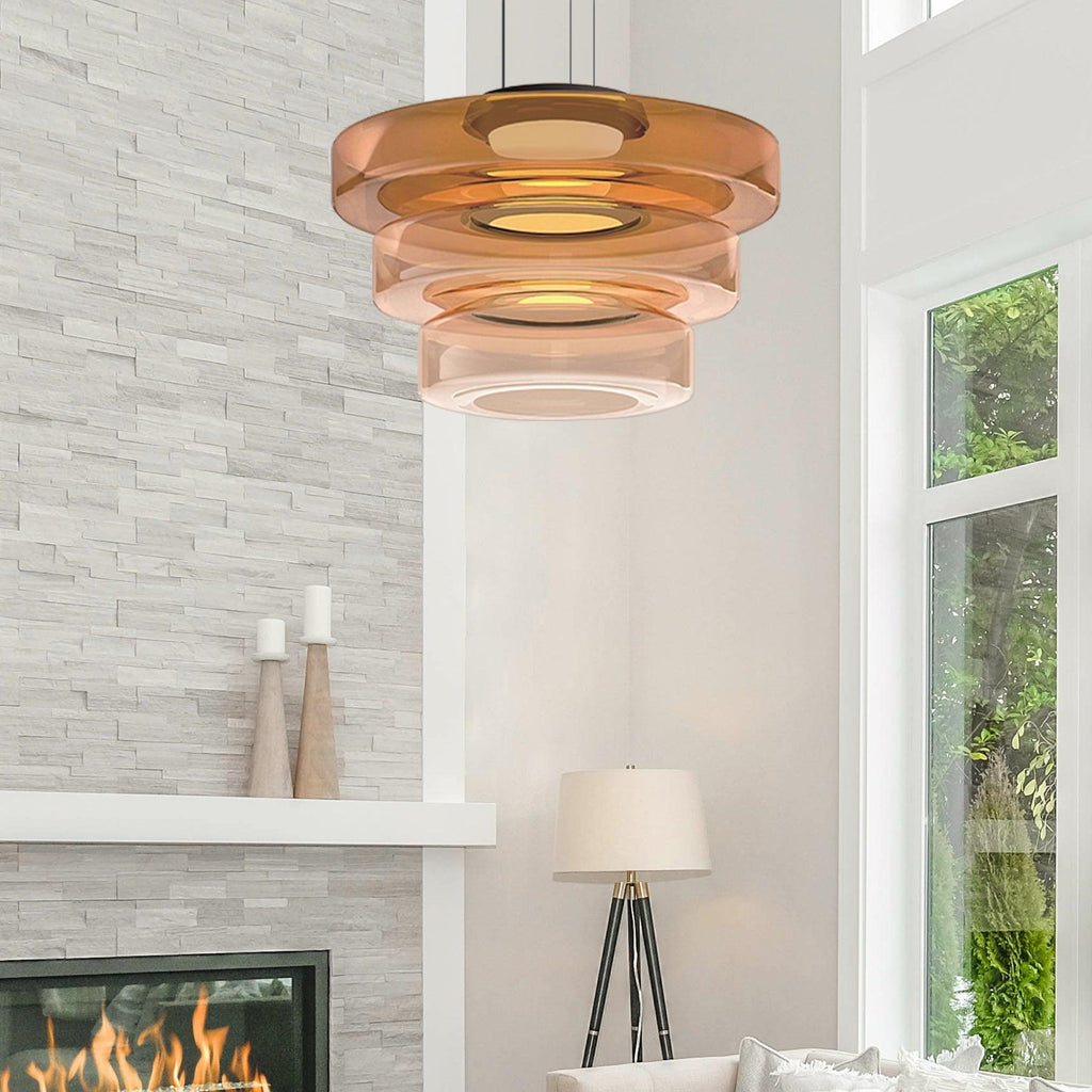 Glass-disc pendant light glowing soft warm light over a table