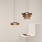 Layered glass pendant light shade detail in soft amber tone