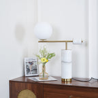 A taller crop of the dresser scene reveals more of the cane door panel beneath the lit Clérachic table lamp.