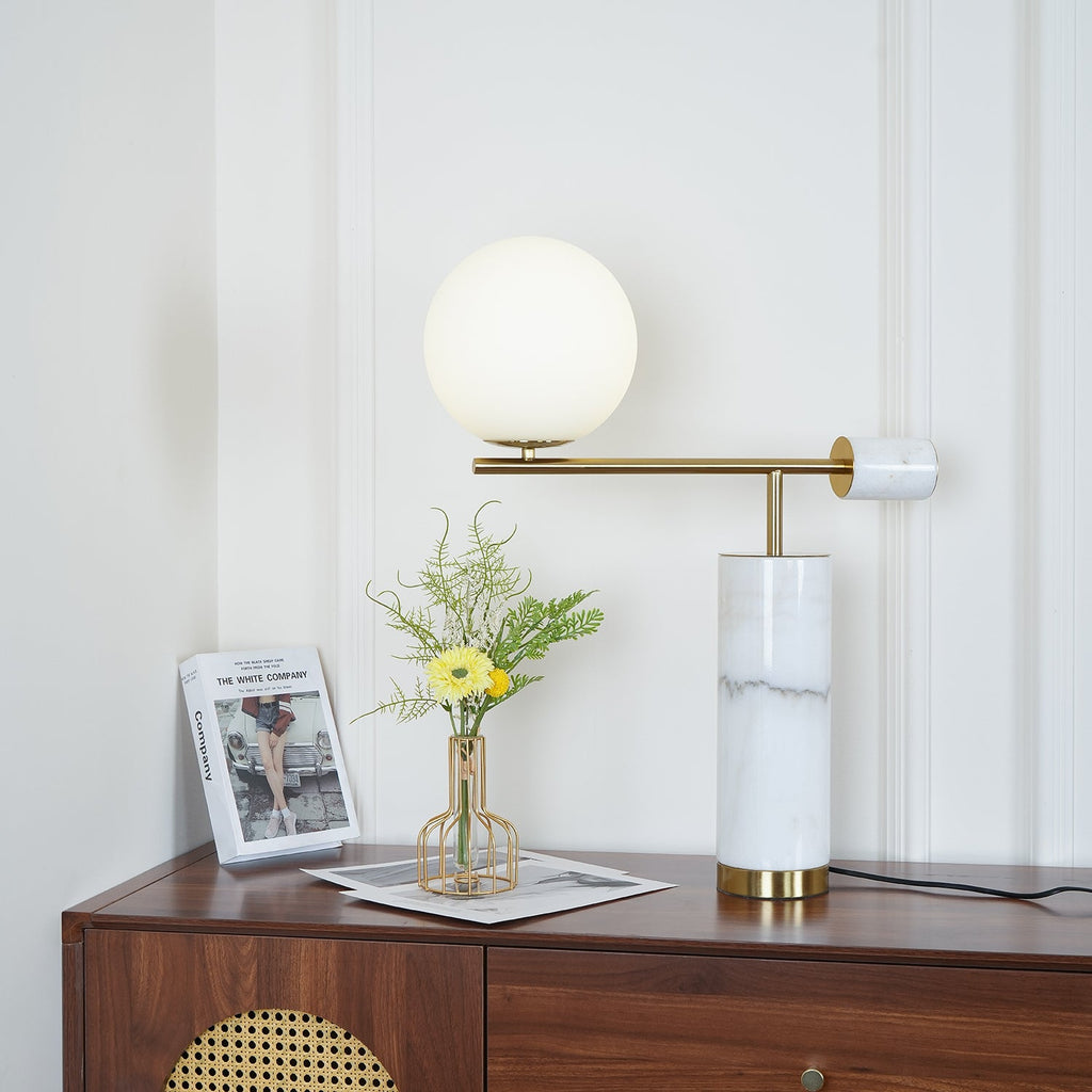 A wider crop of the dresser scene shows the lit Clérachic lamp against the full panelled wall behind it.