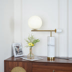 A wider crop of the dresser scene shows the lit Clérachic lamp against the full panelled wall behind it.