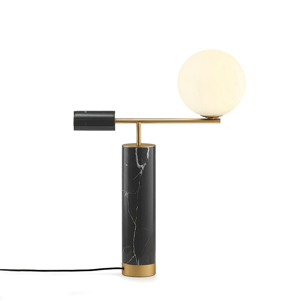 Against a plain backdrop, the Clérachic lamp's cord trails from its base while the glass globe sits right of frame.