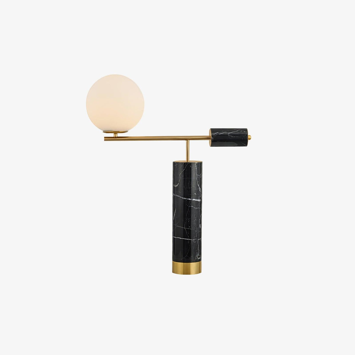A plain white cutout of the Clérachic gold table lamp, its black marble column and glass globe shown with no props.