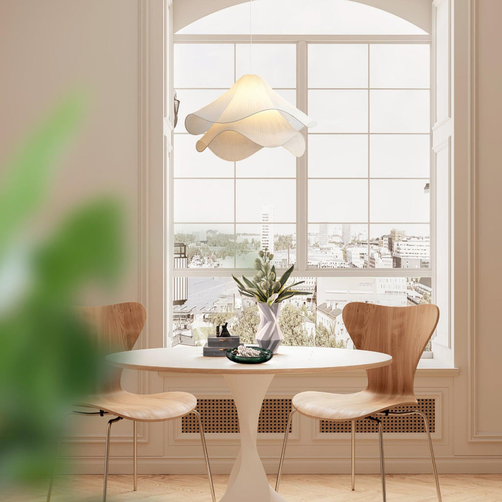 Ethereal Bloom plug-in pendant light styled over a dining area, white bloom shade in focus