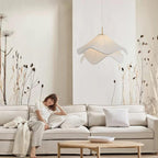 Ethereal Bloom plug-in pendant light glowing above a seating area in a cosy room
