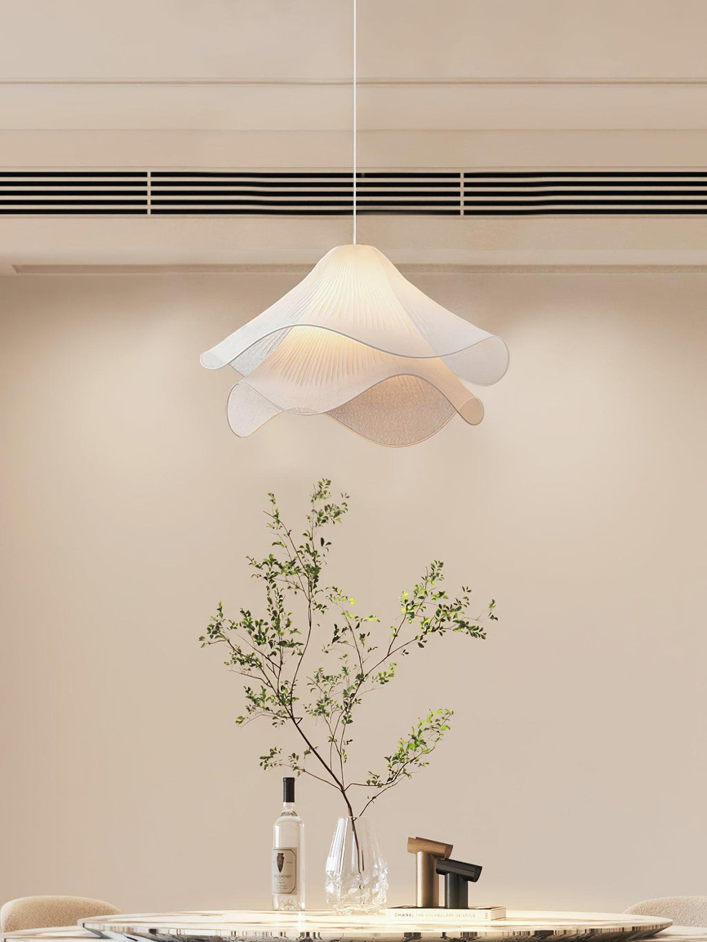 Ethereal Bloom pendant light styled over a dining area, white bloom shade in focus