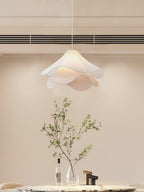 Ethereal Bloom pendant light styled over a dining area, white bloom shade in focus
