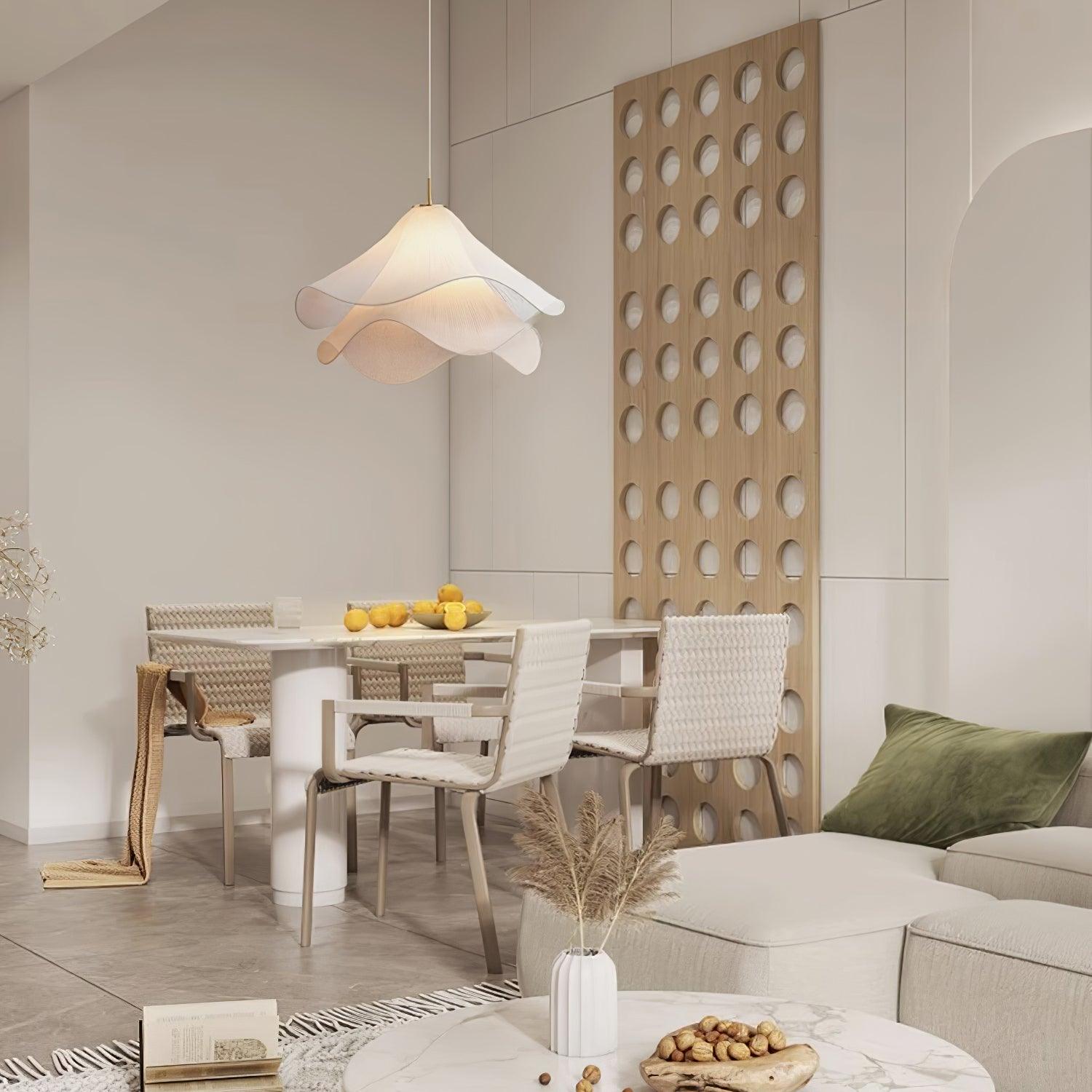 Ethereal Bloom pendant light hanging in a bright room, gold hardware catching light