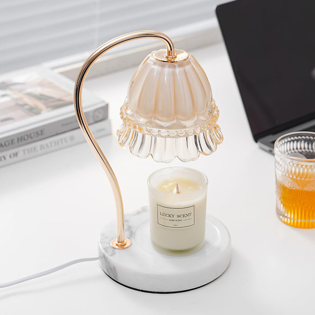 With books and a laptop close by, this Clérachic candle warmer lamp stands on a desk beside a glass of iced drink.