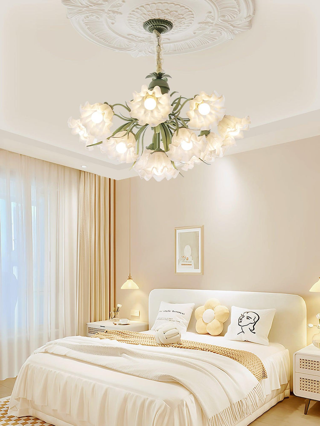 Close above a cream bed and gallery wall, this Clérachic chandelier glows warm in the bedroom.