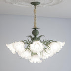On a grey backdrop, this Clérachic chandelier's shades fan out unlit, showing its green metal frame in full.