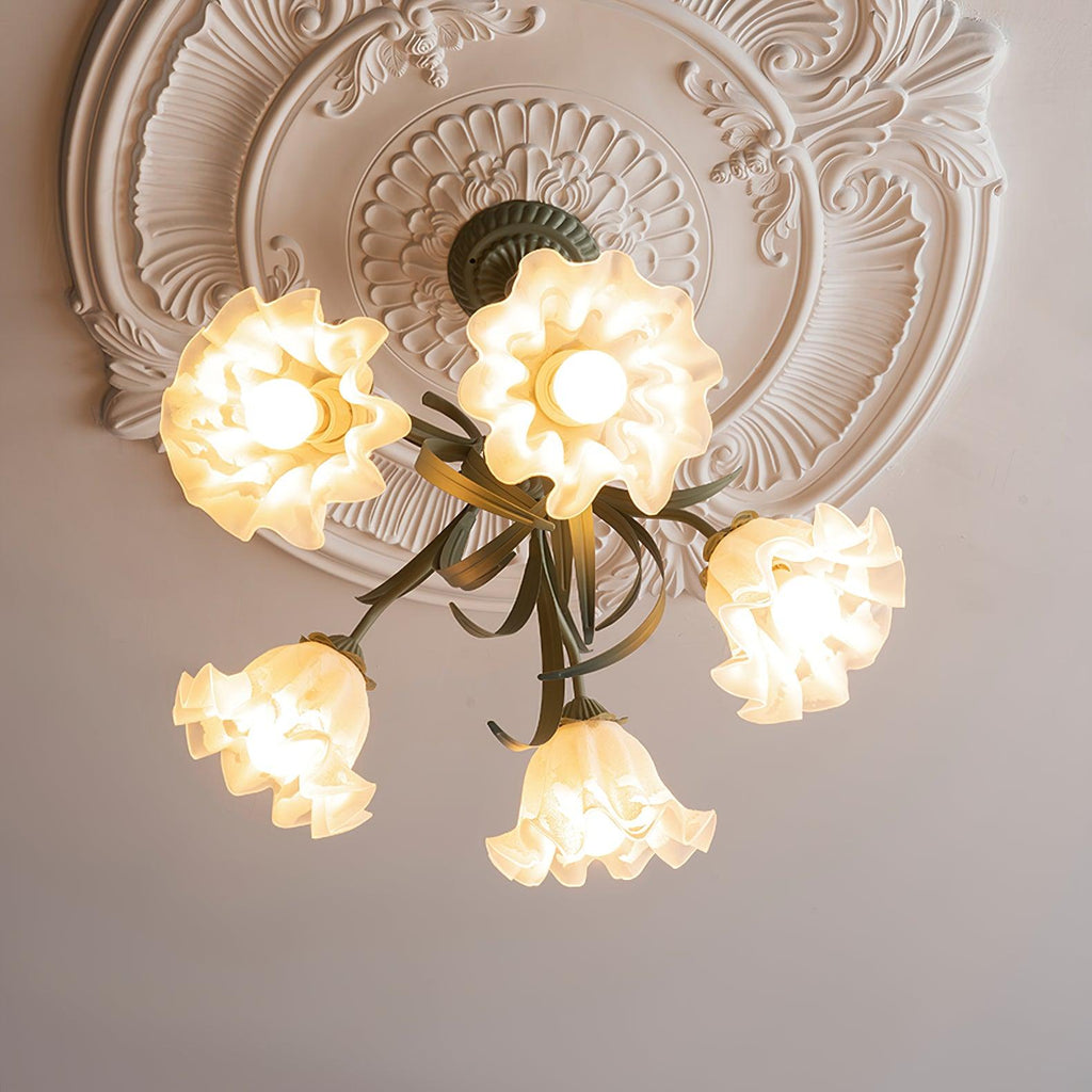 Close beneath an ornate plaster ceiling medallion, this Clérachic chandelier's warm-lit shades fill the frame.