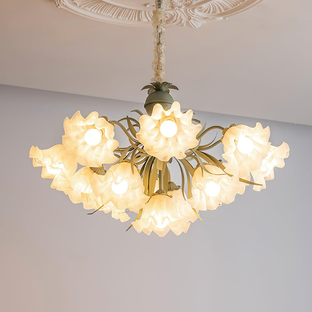 Seen from below on a grey backdrop, this Clérachic chandelier's green stems curve beneath its lit white shades.