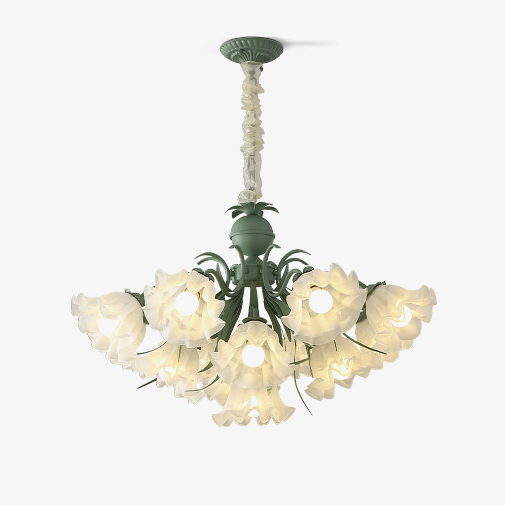Seen against a plain white backdrop, this Clérachic chandelier shows its green metal frame and ruffled white shades lit from within.
