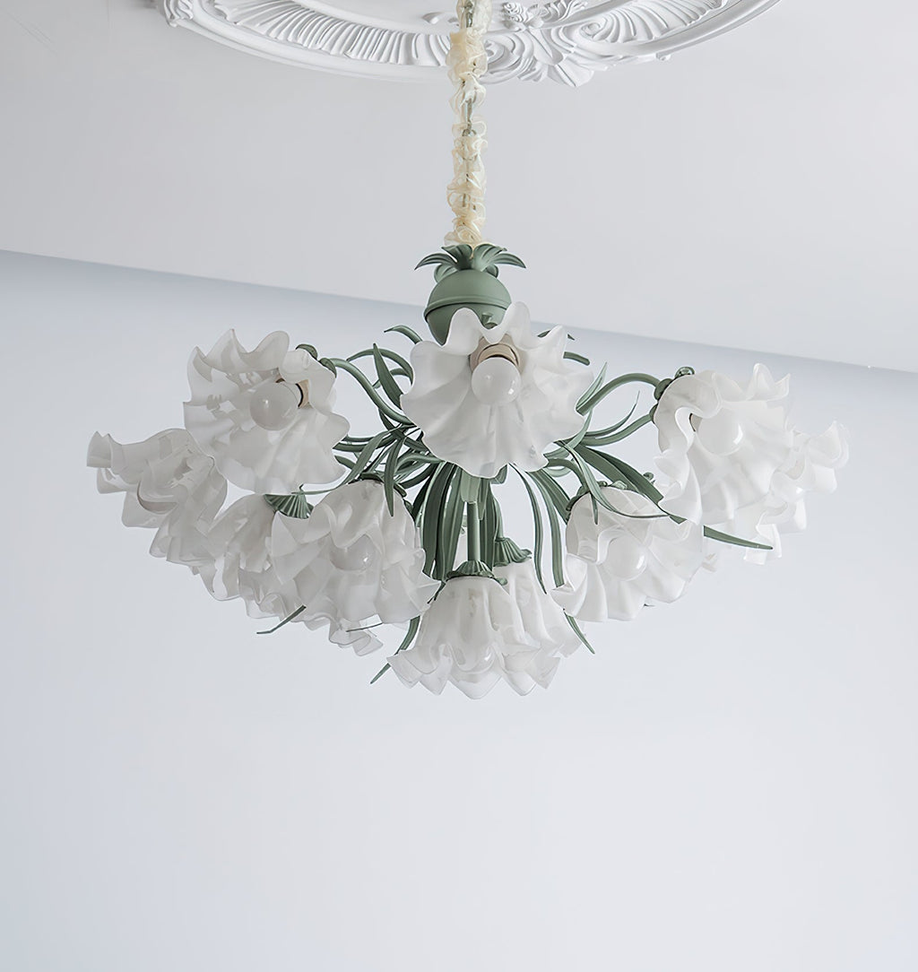 On a grey and white backdrop, this Clérachic chandelier's shades spread wide, unlit, around its green frame.