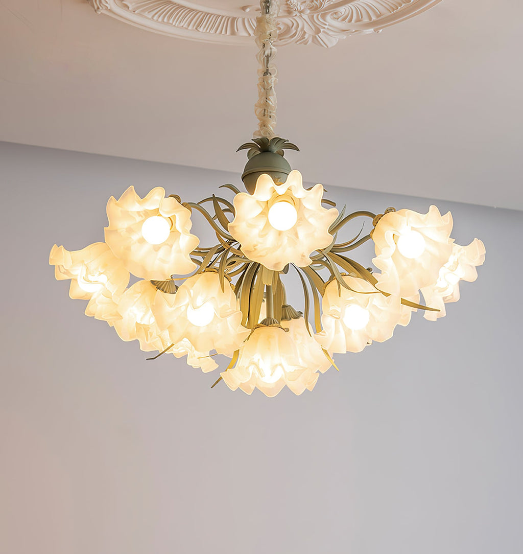 Seen from below on a grey backdrop, this Clérachic chandelier's shades glow warm gold at every head.
