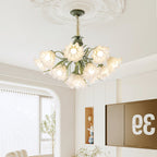 In a bright living room with sheer curtains, this Clérachic chandelier hangs from a carved ceiling medallion, its shades lit warm gold.
