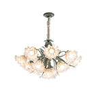 On a grey backdrop, this Clérachic chandelier is shown unlit, its shades fanned in a tight cluster.