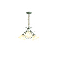 On a plain white backdrop, this Clérachic chandelier hangs unlit, its cluster of shades bunched close together.