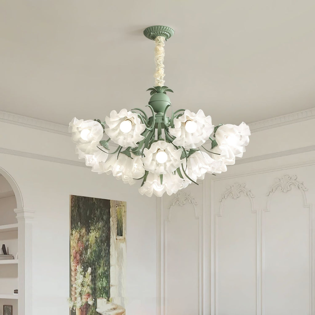 Angled against ornate wall panelling and a framed painting, this Clérachic chandelier's layered white shades glow warm.