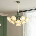 Beside a green door frame and patterned curtain, this Clérachic chandelier hangs lit at an angle.