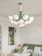 Beneath ornate wall panelling in a living room, this Clérachic chandelier glows above a green sofa.