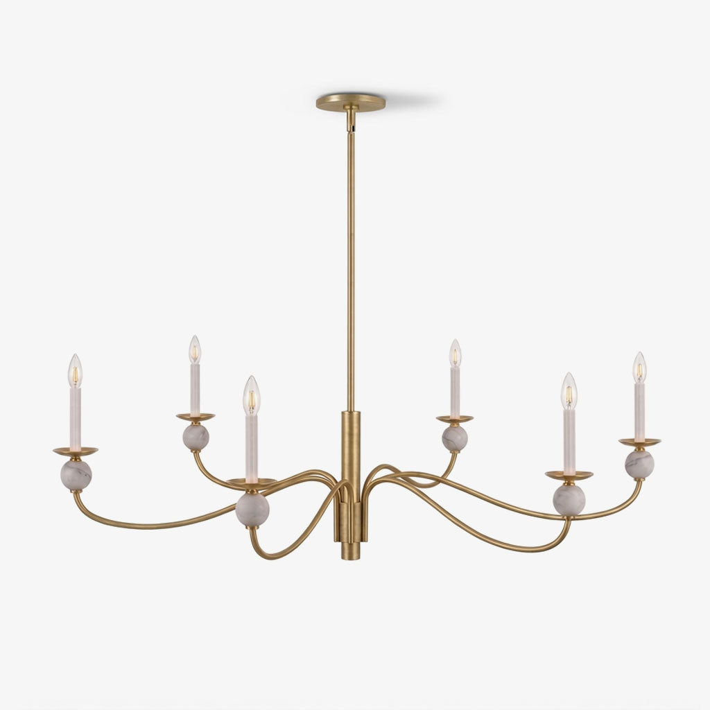 On a plain backdrop, the wave arms and stone ball accents of this Clérachic chandelier show a brushed brass finish, unlit and front-on.