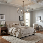 Lit beneath a coffered ceiling, this Clérachic chandelier in matte black hangs above a beige bed with a gallery wall of framed art.