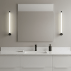 Black slim linear wall sconce against a plain wall