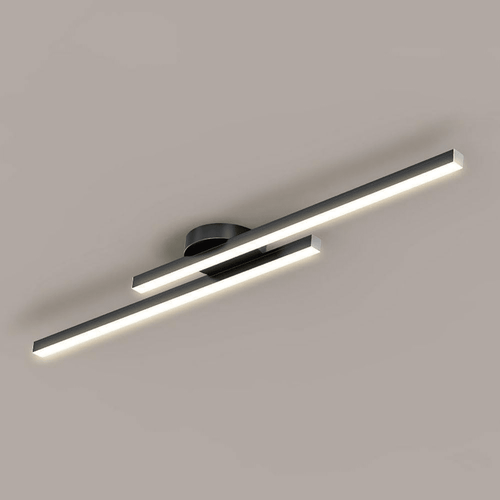 Close angled view of the black fixture lit, showing the two offset LED bars and round mounting base.