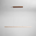 This Clérachic pendant's dark wood canopy and travertine bar are shown unlit against a soft grey backdrop.