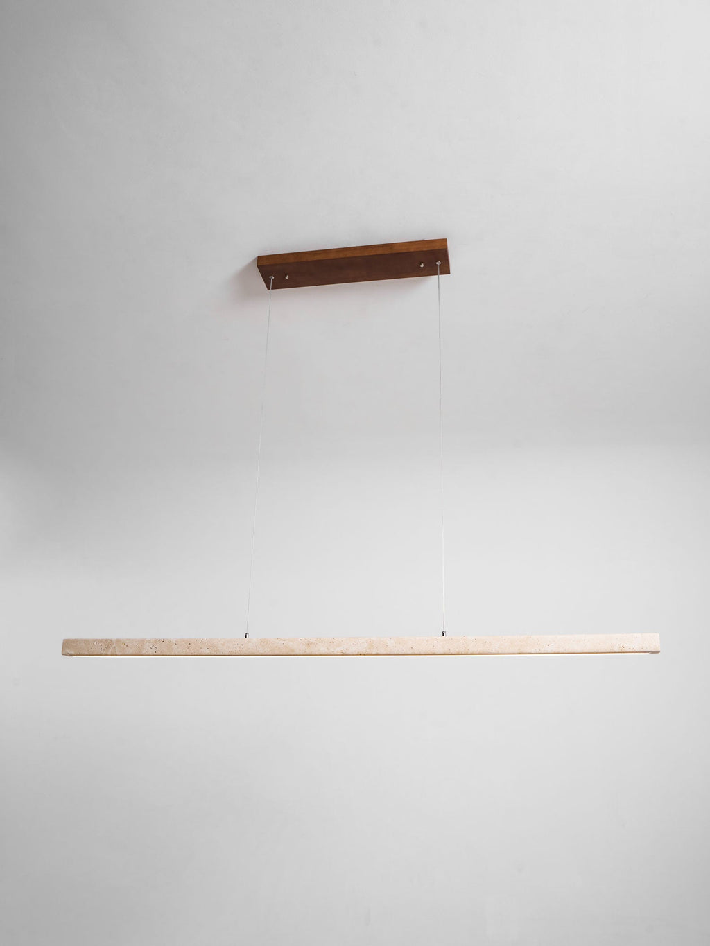 Product-only view of this Clérachic pendant on a dark wood canopy, its travertine bar shown unlit against a grey backdrop.