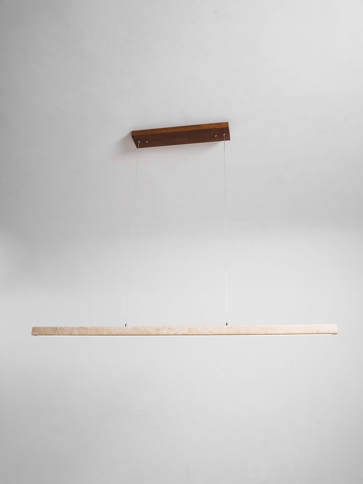 Product-only view of this Clérachic pendant on a dark wood canopy, its travertine bar shown unlit against a grey backdrop.