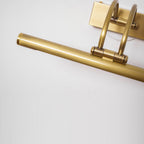 Cylindrical dark bronze vanity bar with white acrylic shade