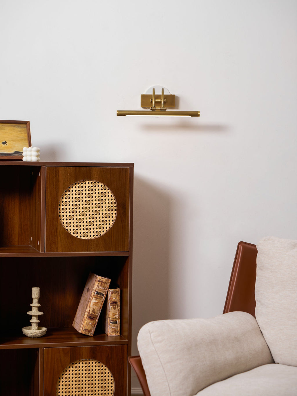 Two-tone vanity wall light with brushed brass mounting detail