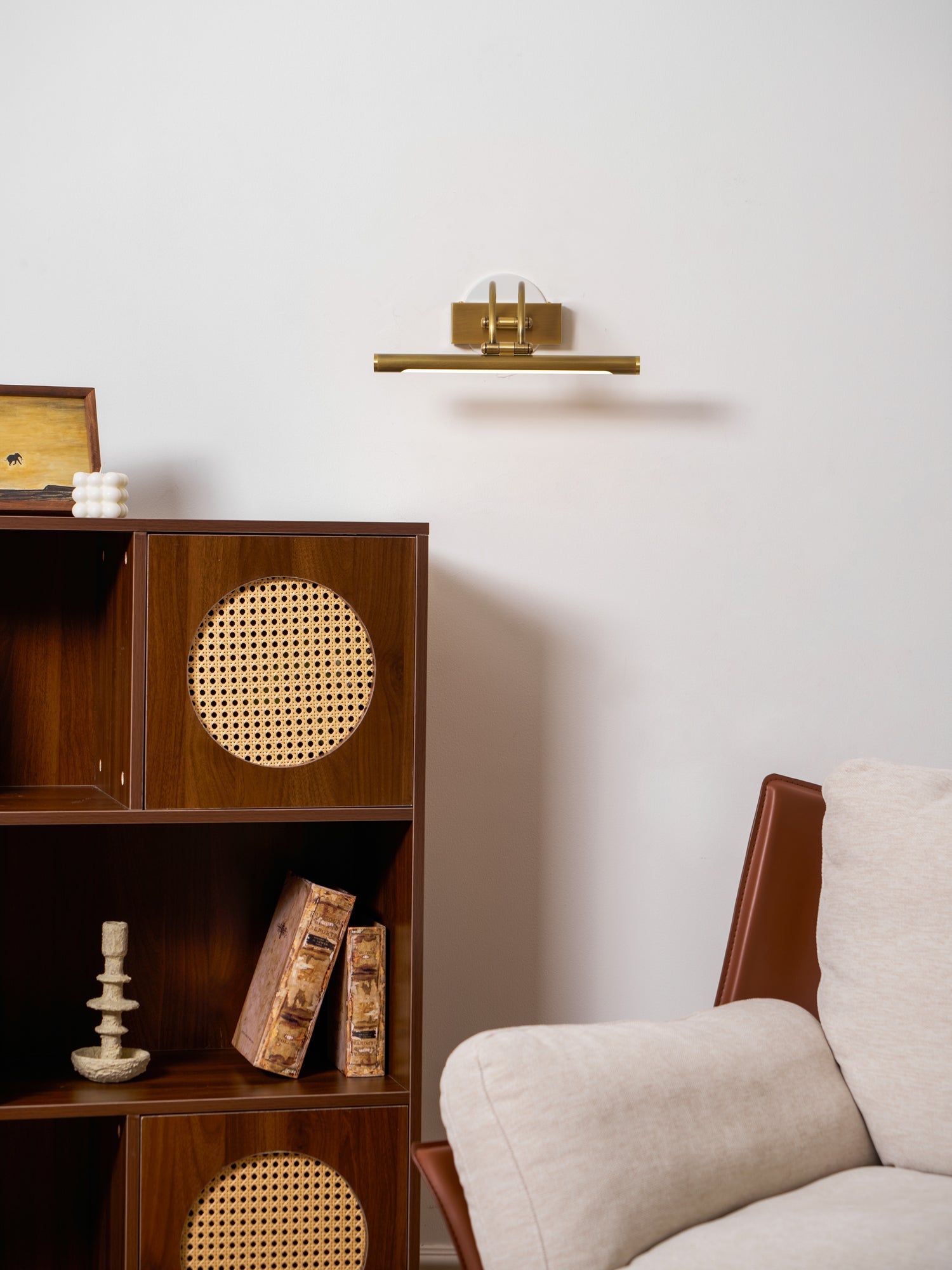 Two-tone vanity wall light with brushed brass mounting detail