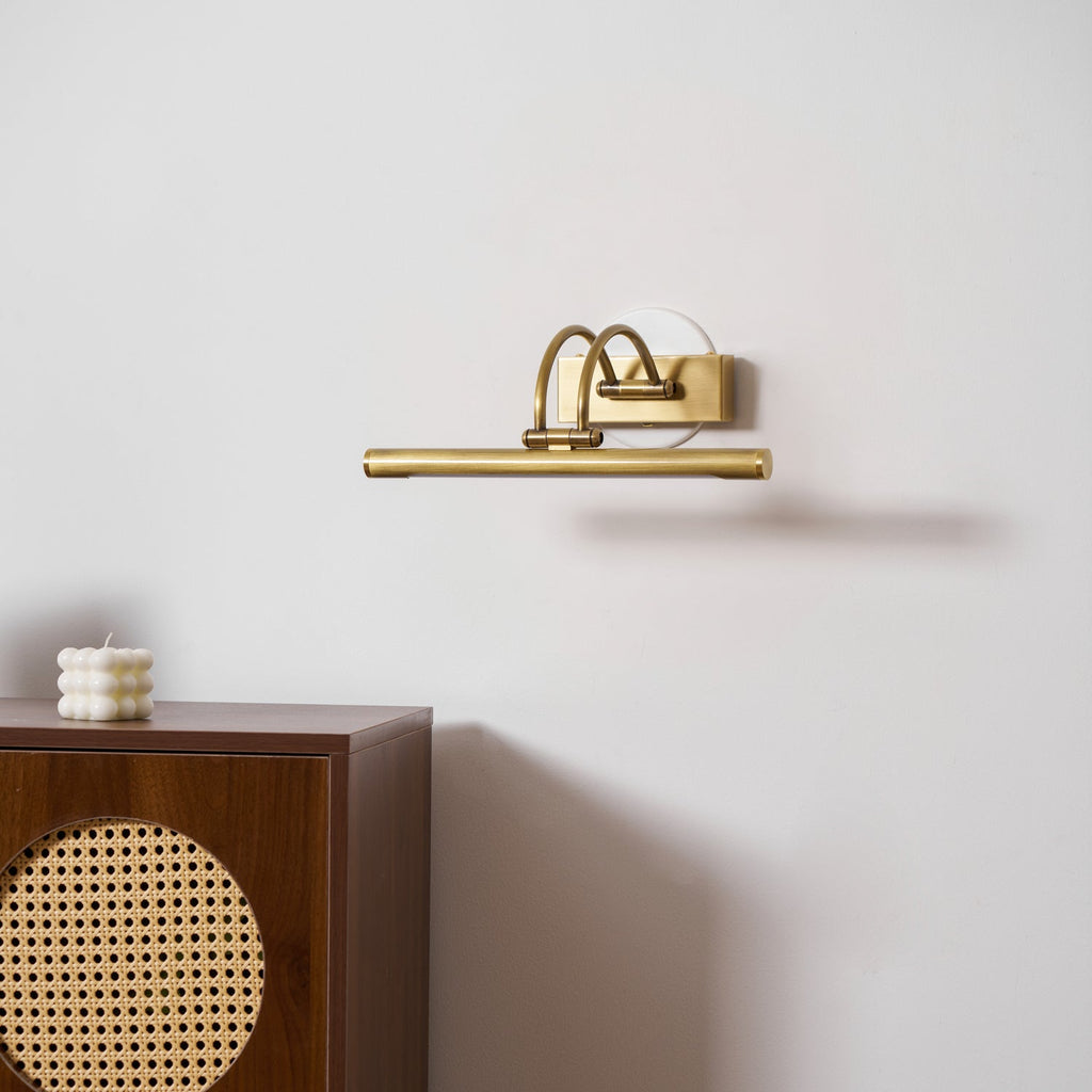 Dark bronze vanity bar with brushed brass accents shown angled