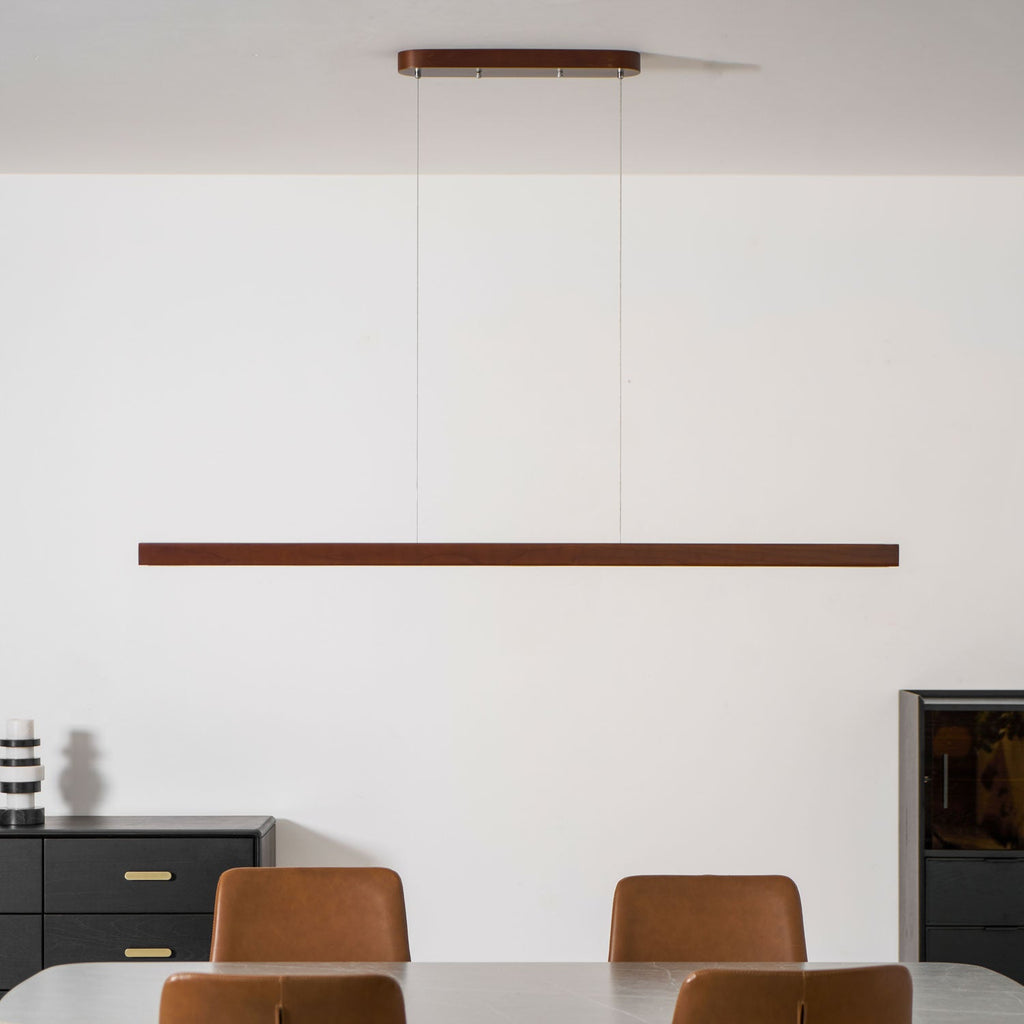 Wooden pendant light slim linear form on a clean background