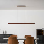 Linear wooden pendant light close view of the warm wood grain