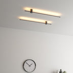 Ultra-slim tube light casting even light across a gallery wall